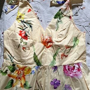 Express tie shoulder peplum top. Pretty yellow floral fabric. Runs small.